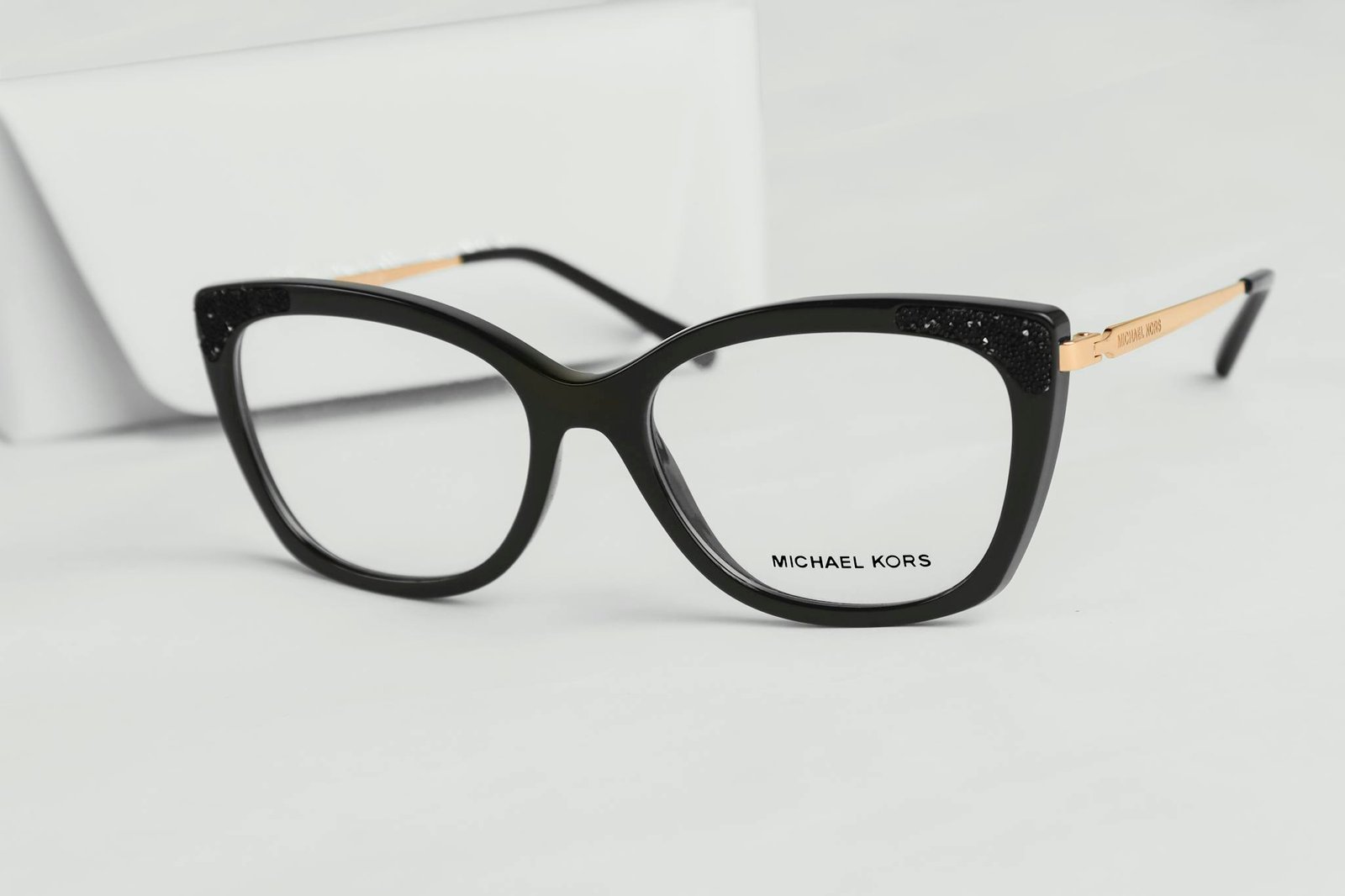 Chic black cat eye eyeglasses by Michael Kors with luxurious design accents.